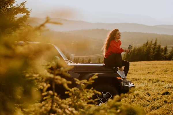 Pretty Young Woman Relaxing Terrain Vehicle Hood Countryside — Foto de Stock