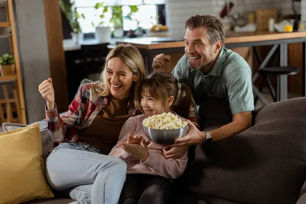 Family Three Comfortably Nestled Couch Faces Reflecting Excitement Attentiveness Share — Stock Photo, Image
