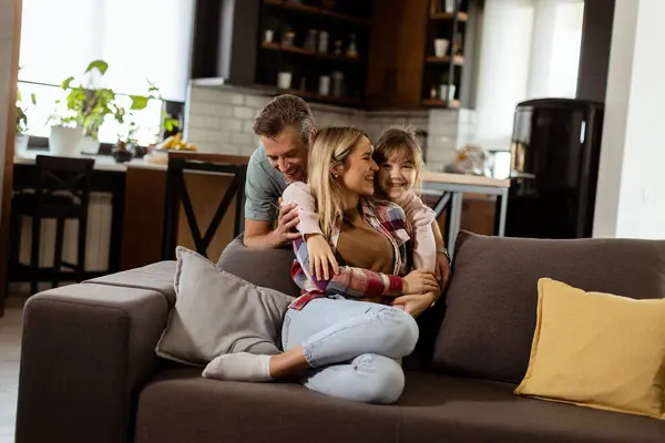 Joyful Family Shares Relaxed Affectionate Moment Sofa Illuminated Soft Natural Royalty Free Stock Images