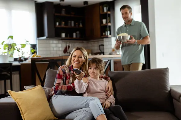 Family Three Comfortably Nestled Couch Faces Reflecting Excitement Attentiveness Share Stock Image