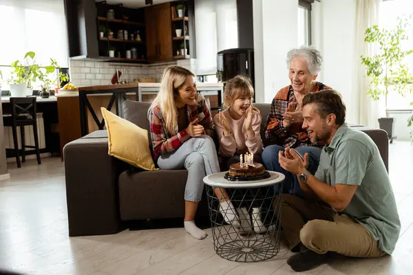 Heartwarming Scene Unfolds Multi Generational Family Gathers Couch Present Birthday Stock Image