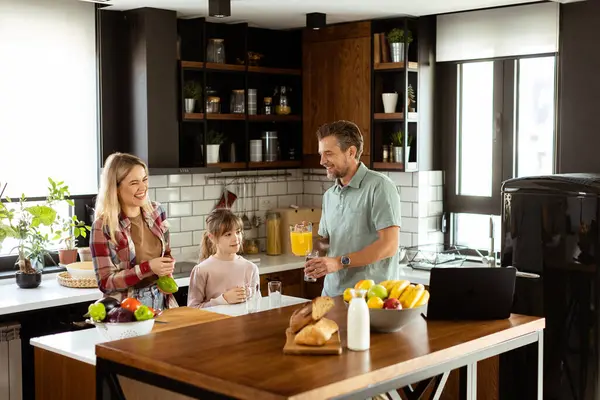 Young Family Chatting Preparing Food Bustling Kitchen Counter Filled Fresh — Stock Photo, Image