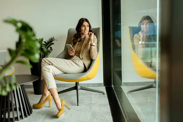 Stylish Professional Chats Her Mobile Phone Stock Image