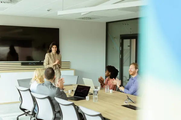 Poised Woman Presents Colleagues Meeting Her Expression Conveying Enthusiasm Leadership Stock Picture