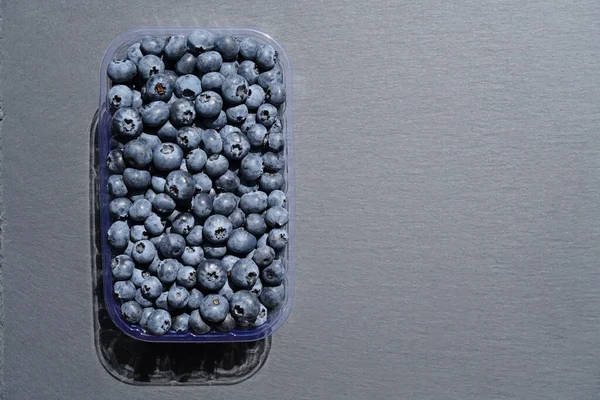 Ripe Blueberries Plastic Box Stone Table — Photo