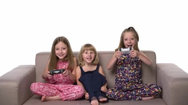 Three Kids Playing Video Game Joystick Sitting Sofa Front View — Wideo stockowe
