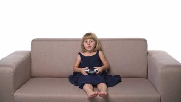 One Joyful Girl Kid Sitting Sofa Playing Video Game Joystick — Vídeo de Stock