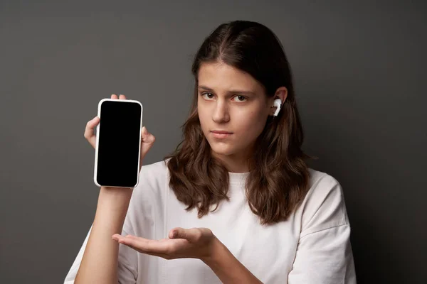 Closeup Portrait Sad Young Woman Showing Presenting Blank Mobile Phone Obrazy Stockowe bez tantiem