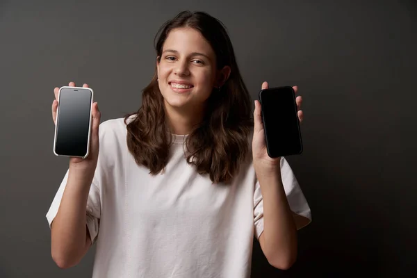 Closeup Funny Smile Teen Girl Showing Blank Screens Two Smart — Stok Foto