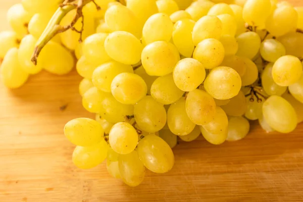 stock image white grape close up on wooden board