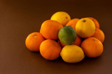 bunch of tropical fruits lemon,oranges and lime