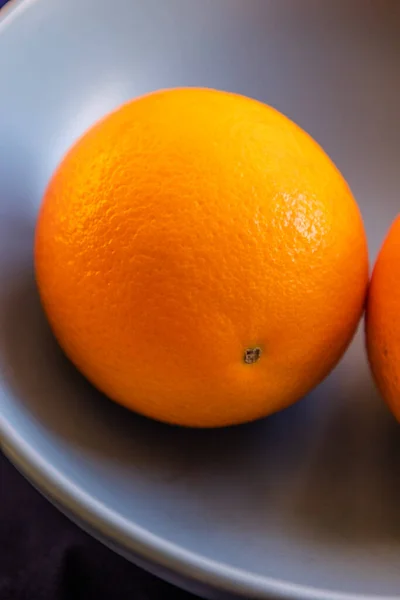 fresh ripe juicy oranges on a black background