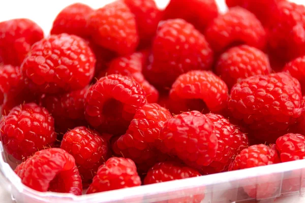 stock image close up fresh raspberries on white background