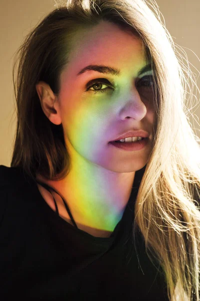 portrait of a pretty woman with rainbow effect