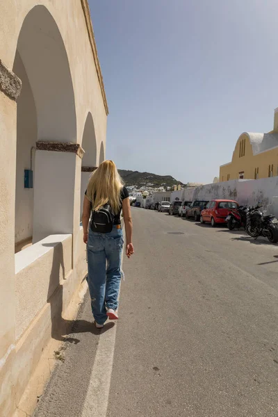 stock image blonde woman exploring santorini greece