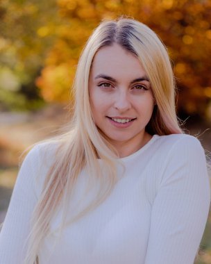 Beautiful Blonde Woman Close-Up Portrait in Fall Setting Outside - Autumn Elegance