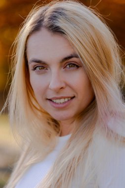 Beautiful Blonde Woman Close-Up Portrait in Fall Setting Outside - Autumn Elegance