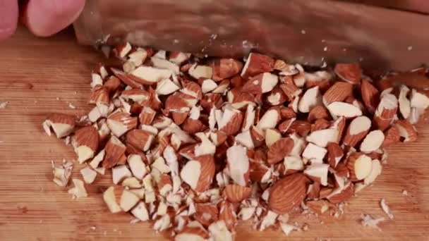 Nutty Perfection Woman Hands Cutting Chopping Almonds Close Wood Board — Stok Video