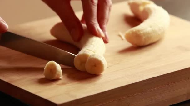Close Woman Slicing Yellow Banana Wooden Cutting Board — Stock Video