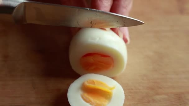 Close Stock Video Capturing Hands Woman Delicately Slicing Boiled Egg — Stock Video