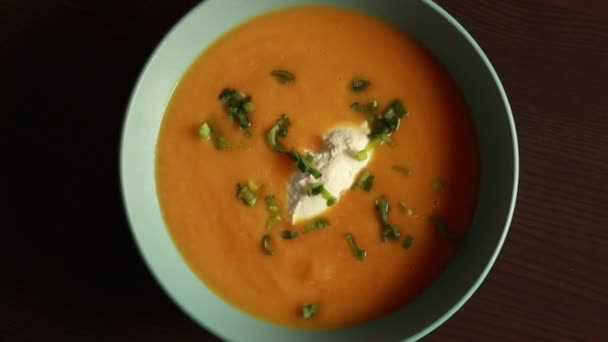 Delicious Carrot Soup Served Blue Bowl Showcasing Comfort Warmth Homemade — Stockvideo