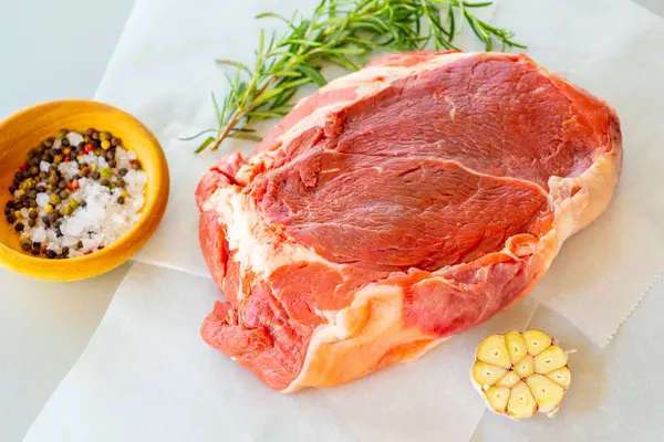 stock image Fresh Raw Veal Cut of Meat with Spices and Rosemary Ready to Cook Close Up