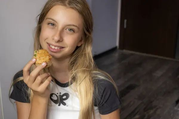 stock image  Kid Eating Healthy Savory Muffin with Pea and Ham in Her Room