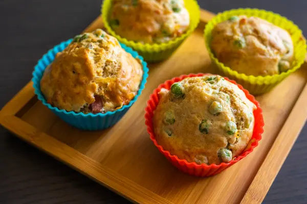 stock image  Savory Muffin with Pea, Ham, and Cheese Close-Up on Dark Background