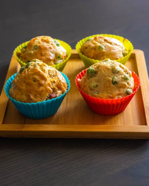 stock image  Savory Muffin with Pea, Ham, and Cheese Close-Up on Dark Background