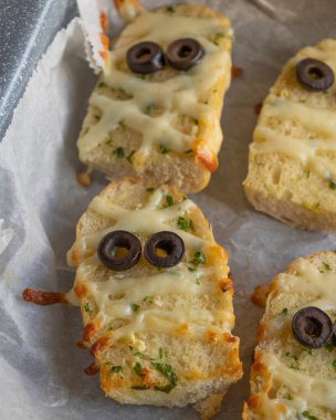 Halloween Garlic Bread Mummies - Delicious Close-Up clipart