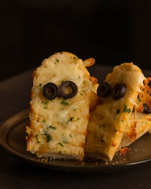 Halloween Garlic Bread Mummies - Delicious Close-Up clipart