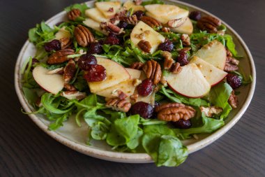  Fall Salad with Arugula, Apples, Cranberries, and Pecans - Close-Up clipart