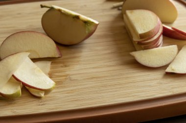 Slices of Apple on Wooden Cutting Board - Close-Up