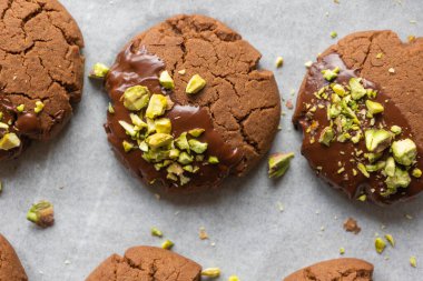 Chocolate Cookies Covered with Chocolate and Sprinkled with Chopped Pistachios  Perfect for Christmas Close-Up clipart