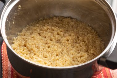 Cooking Quinoa in a Small Pot Close-Up clipart