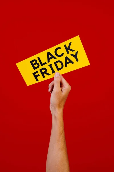 Closeup Man Holding Yellow Sign Text Black Friday Red Background — Stock Photo, Image