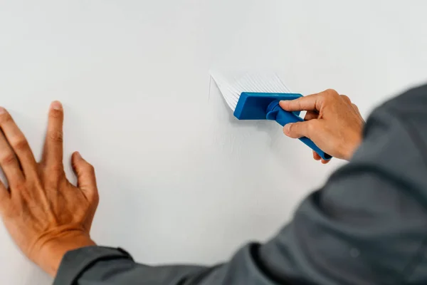 Closeup Caucasian Man Wearing Gray Working Coat Spreading Some Glue — Stock Photo, Image
