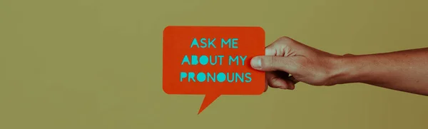 Holds Paper Sign Shape Speech Balloon Text Ask Pronouns Green — Stock Photo, Image