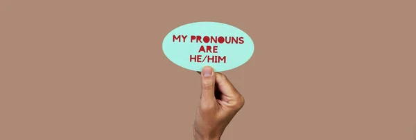 Person Has Green Sign Text Pronouns Him Written Red Brown — Stock Photo, Image