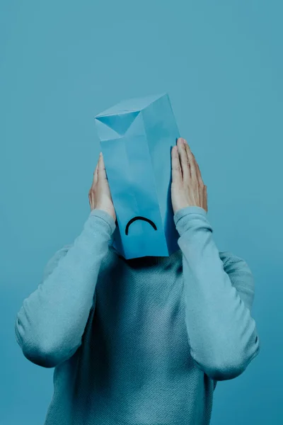 Man Wearing Blue Paper Bag His Head Sad Mouth Drawn — Photo