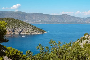 a view over the Aegean sea, as seen from the top of a hill in Nea Epidavros, Greece