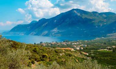 a view over the coast and the Aegean sea as seen from a hill in Epidauros, Greece