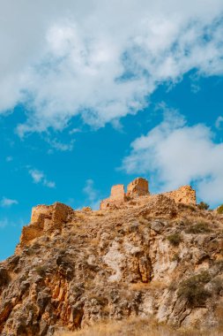 a view of the remains of the Santa Croche castle, in Albarracin, Spain, on top of a hill
