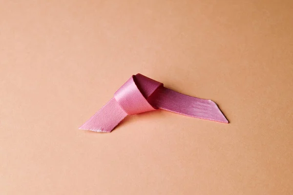 Closeup Used Pink Awareness Ribbon Pale Pink Background Depicting Concept — Foto Stock
