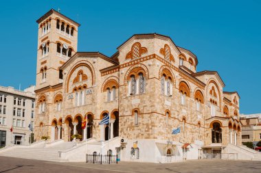 a view of the facade of the Hagia Triada Cathedral in Piraeus, Greece, on a summer day