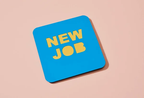 Blue Paper Sign Text New Job Pale Pink Background — Stockfoto