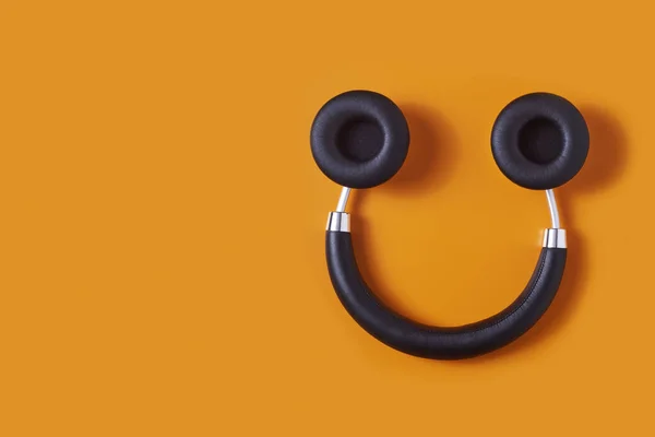 Pair Black Wireless Full Size Headphones Upside Orange Background Resembling — Stock Photo, Image
