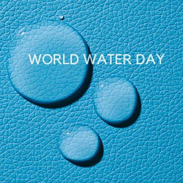 Közelkép Néhány Csepp Tiszta Víz Egy Kék Texturált Felületen Szövegvilág — Stock Fotó