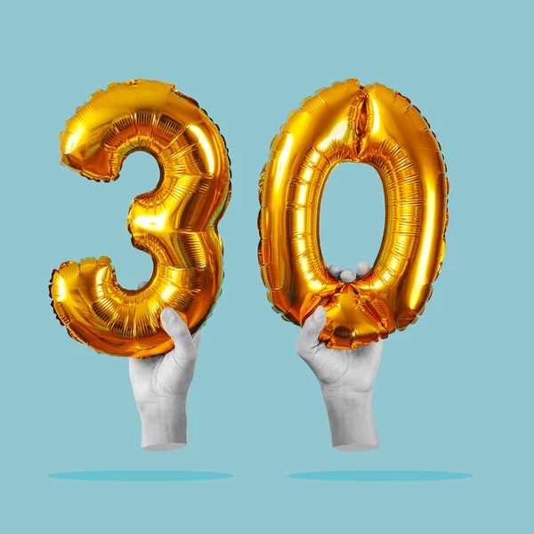 Two Hands Black White Holding Two Golden Number Shaped Balloons — Stock Photo, Image