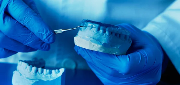 Technician Wearing Blue Latex Gloves Adjusting Occlusal Splint Panoramic Format — Stock Photo, Image
